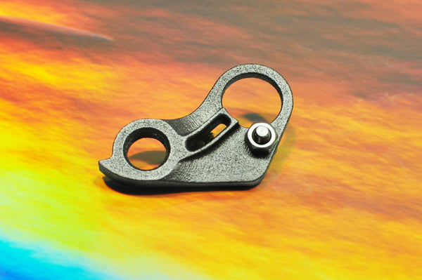 Sturdy titanium derailleur hanger on an iridescent background