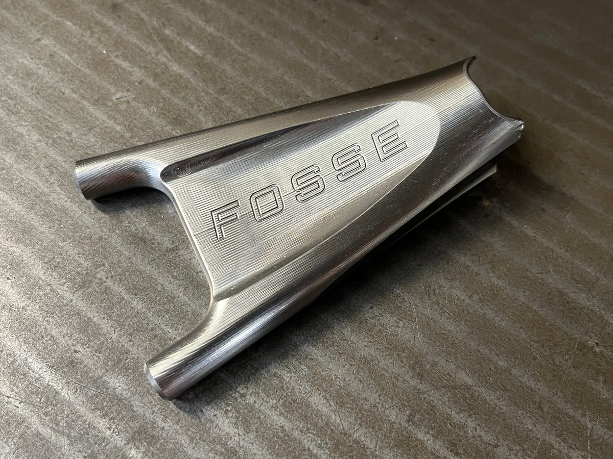 Machined titanium seat stay yoke engraved with Fosse