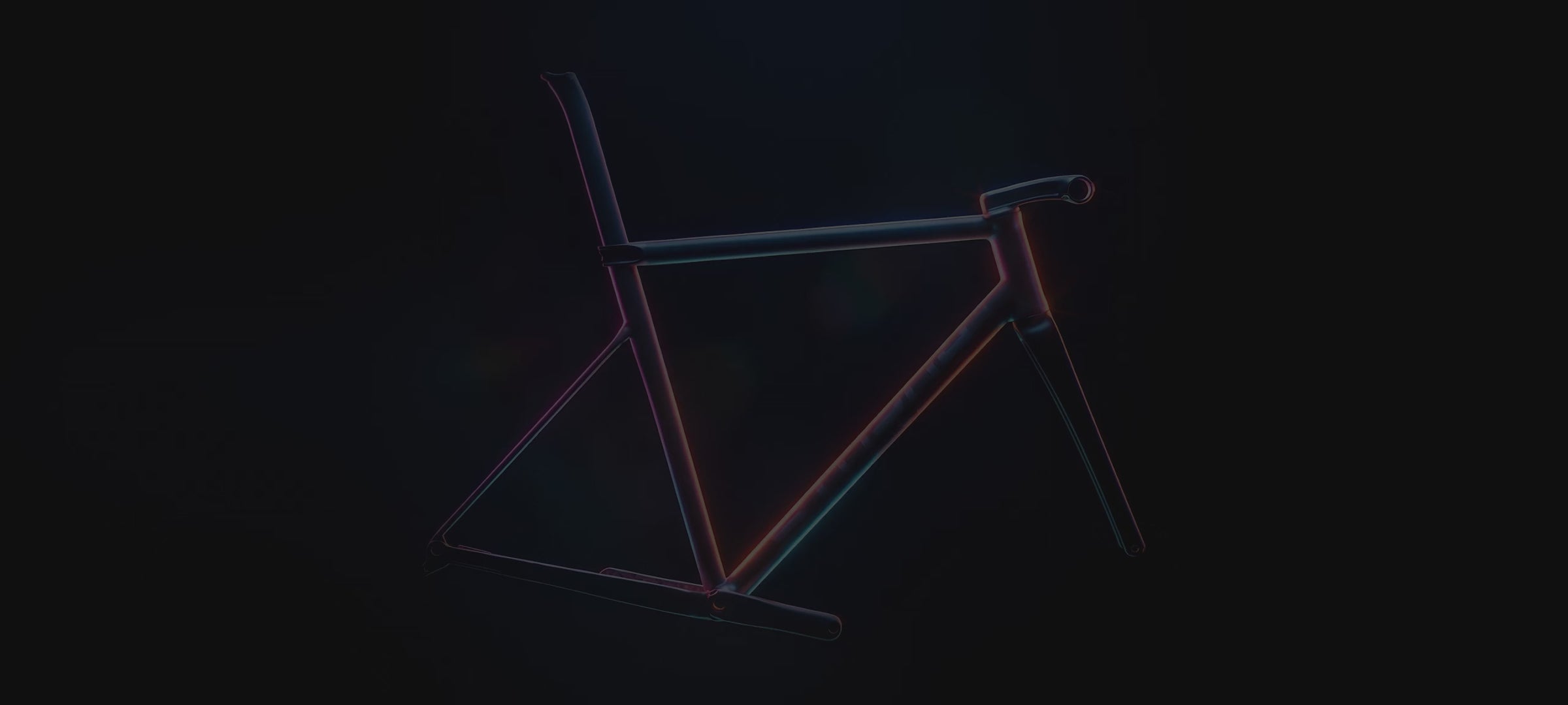 Titanium frames made in the UK: a Sturdy titanium bicycle frame lit by pink, orange and blue light, with the STURDY wordmark